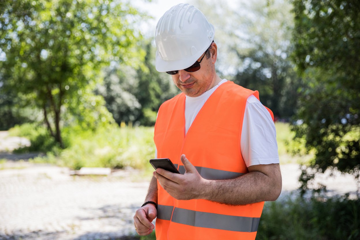 Construction worker using phone